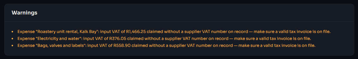 A warnings panel listing three expenses where input VAT was claimed without a supplier VAT number on record, each naming the expense and the amount at risk.